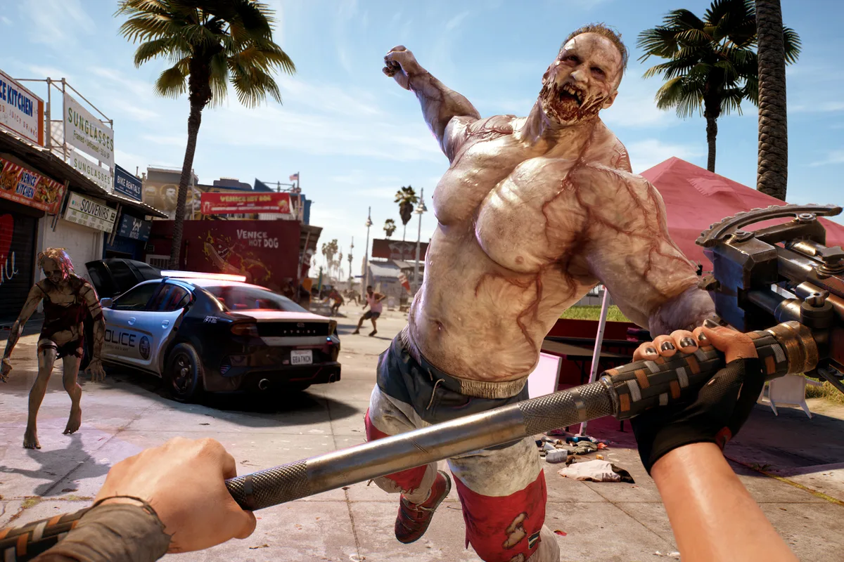 Un survivant affronte un zombie massif sur la promenade de Venice Beach dans Dead Island 2
